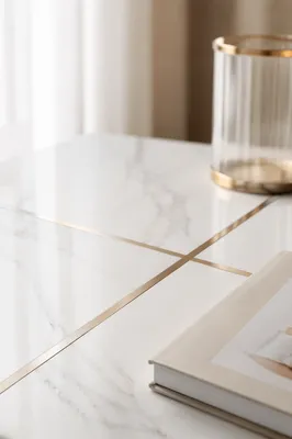 White Marble Background with Gold Cross Accent