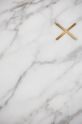 Elegant White Marble with Gold Cross