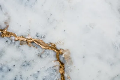 White Marble Background with Gold Cross Accent