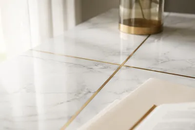 White Marble Background with Gold Cross Accent