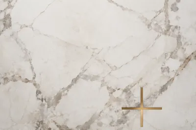 White Marble Background with Gold Cross Accent