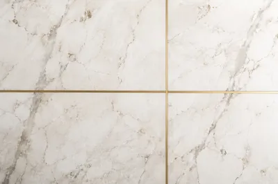 White Marble Background with Gold Cross Accent