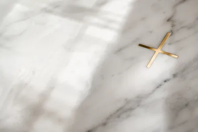 Elegant White Marble with Gold Cross