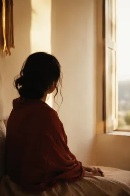 Weary Soul Resting in Gentle Window Light