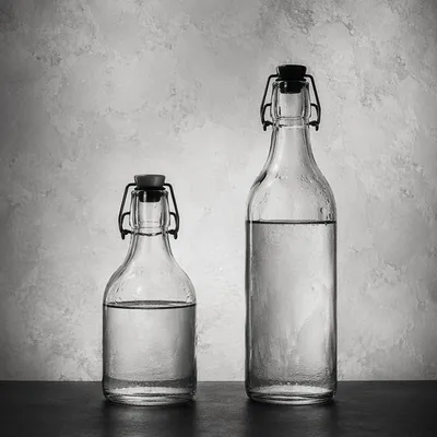 Minimalist Glass Bottles on Gray Background