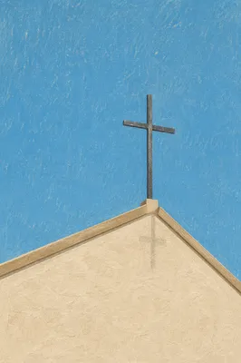 Minimalist Cross Above Beige Chapel Roof