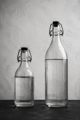 Minimalist Glass Bottles on Gray Background