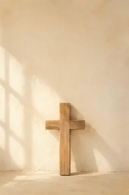 Minimalist Wooden Cross on Cream Background