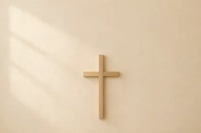 Minimalist Wooden Cross on Ivory Wall