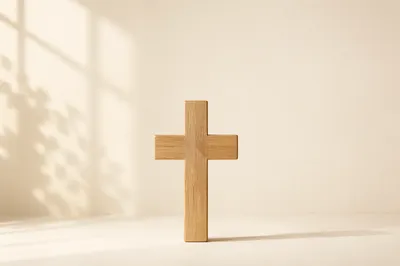 Minimalist Wooden Cross on Warm Neutral Background