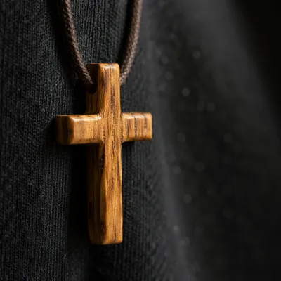 Minimalist Wooden Cross on Charcoal Fabric