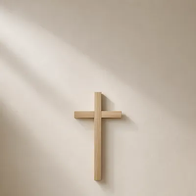 Minimalist Wooden Cross on Plaster Wall