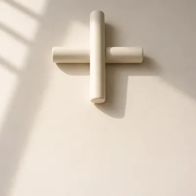 Minimalist Ceramic Cross on Warm Background