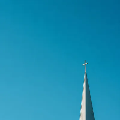 Minimalist Church Cross Against Turquoise Sky