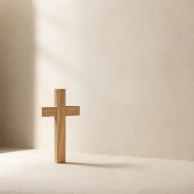 Minimal Wooden Cross on Clean Ivory Background