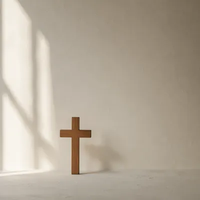 Minimal Wooden Cross on Cream Background