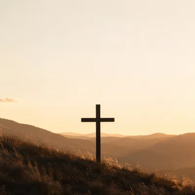 Minimal Wooden Cross on Serene Sunrise Hill