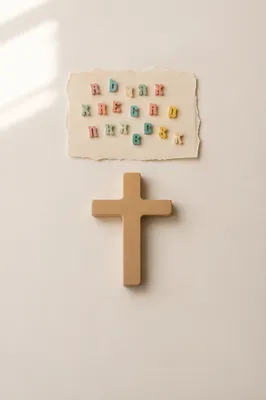 Minimal Wooden Cross on Warm Cream Background