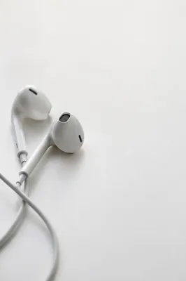 Minimal Earbud Cross on White Background