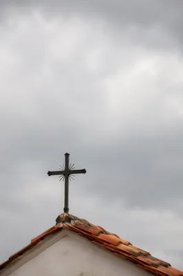 Minimalist Church Cross Over Terracotta Roof