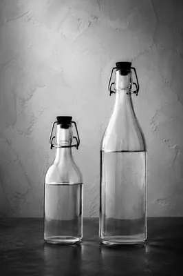 Minimalist Glass Bottles on Gray Background