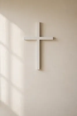 Minimal White Cross on Warm Cream Wall