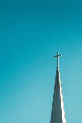 Minimal Church Cross Against Turquoise Sky