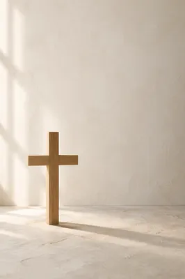 Minimal Wooden Cross on Clean Ivory Background