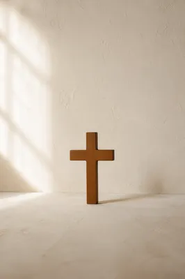 Minimal Wooden Cross on Serene Plaster