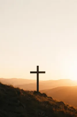 Minimal Wooden Cross on Sunrise Hillside