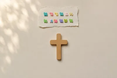 Minimal Wooden Cross on Warm Cream Background