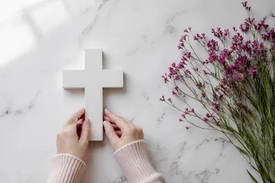 Minimalist White Cross with Magenta Wildflowers