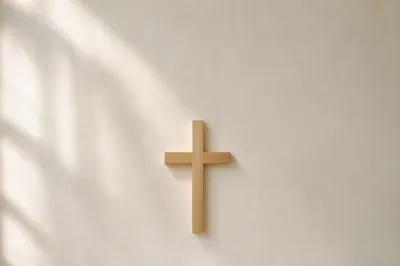 Minimalist Wooden Cross on Plaster Wall