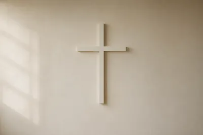 Minimalist White Cross on Cream Wall
