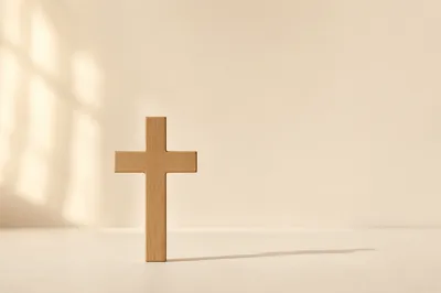 Minimal Wooden Cross on Warm Ivory Background