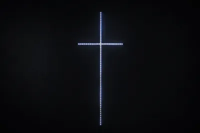 Minimal Luminous Cross on Charcoal Background