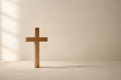 Minimal Wooden Cross on Clean Ivory Background