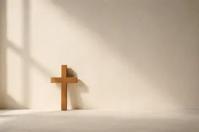 Minimal Wooden Cross on Cream Background