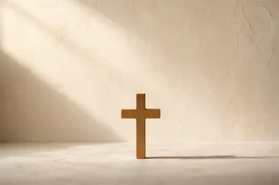 Minimal Wooden Cross on Serene Plaster Background