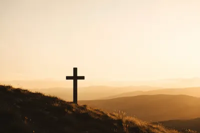 Minimalist Wooden Cross on Sunrise Hillside