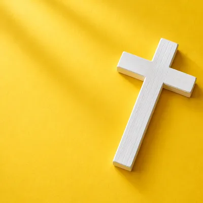 Minimalist White Cross on Golden Background
