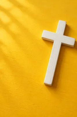 Minimalist White Cross on Golden Background