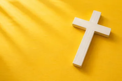 Minimalist White Cross on Golden Background