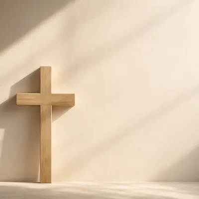 Minimal Wooden Cross on Cream Wall