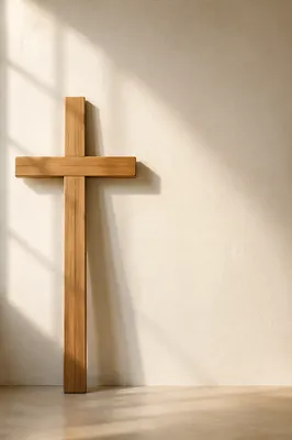 Simple Wooden Cross on Cream Wall