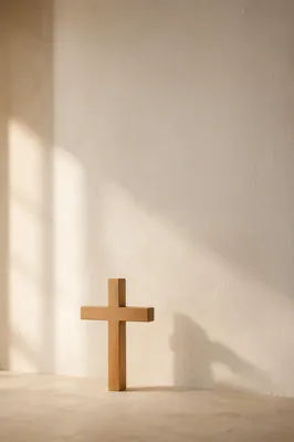 Minimal Wooden Cross on Pale Wall