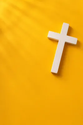 Minimalist White Cross on Golden Background