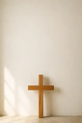 Simple Wooden Cross on Cream Wall