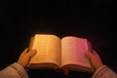 Open Bible in Hands with Warm Glow