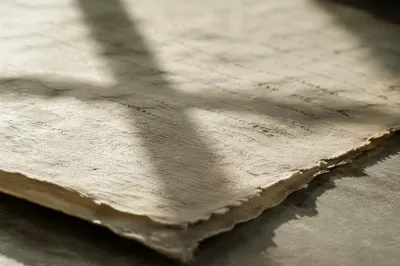 Aged Parchment With Gentle Cross Shadow